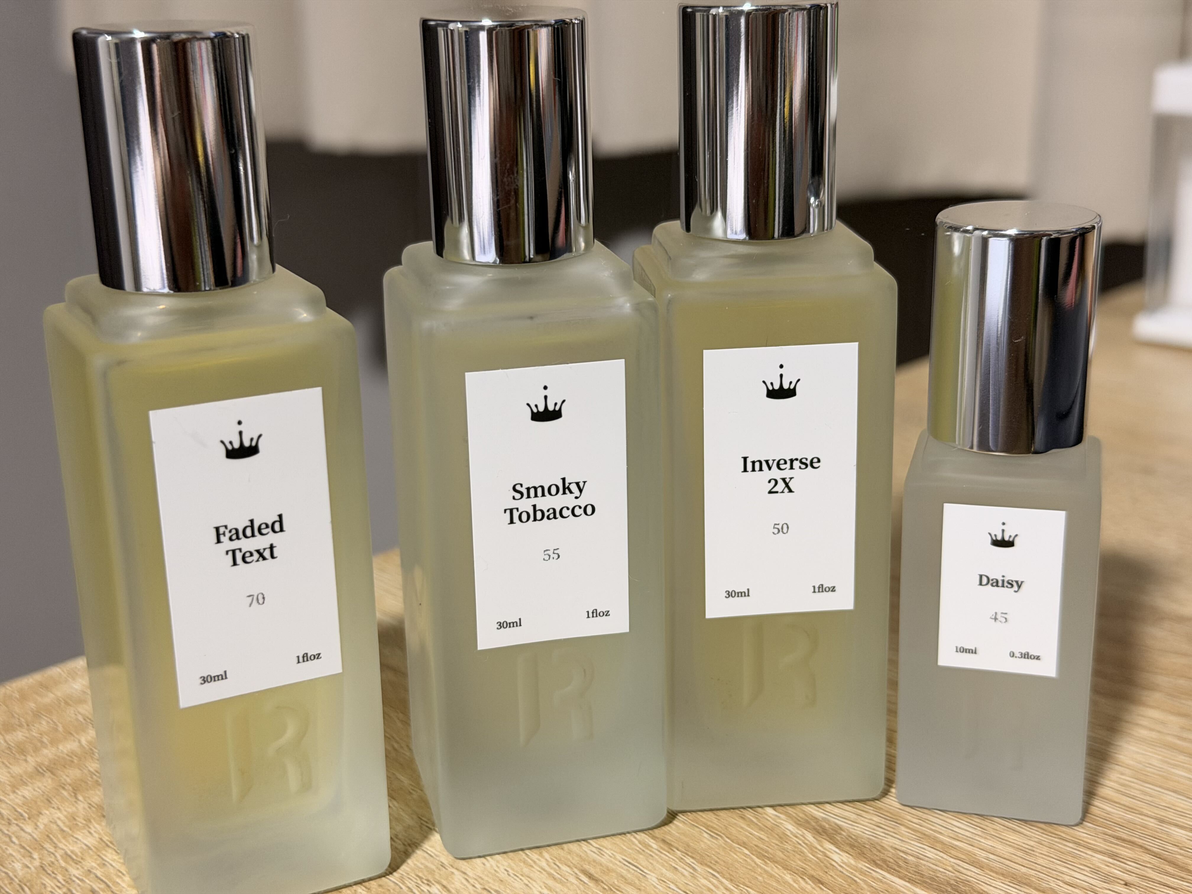 Four Royal Water perfume bottles purchased: Faded Text, Smoky Tobacco, Inverse 2X, and Daisy