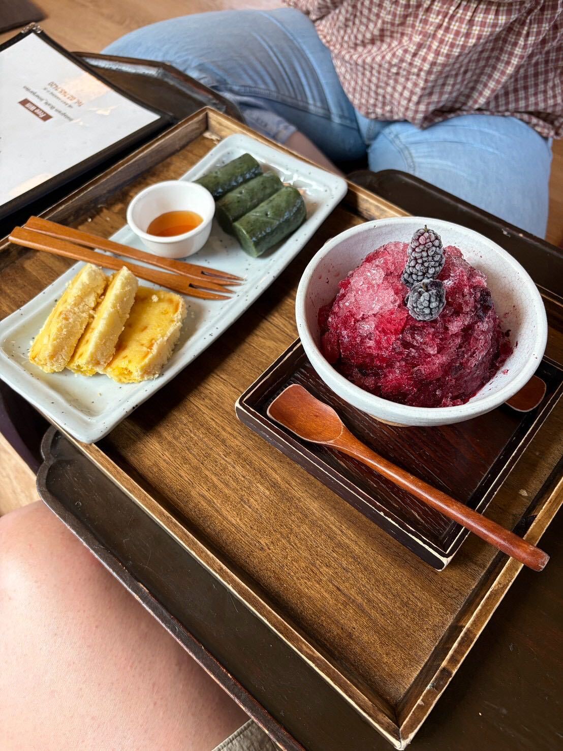 A bowl of berry bingsu and a plate of tteok rice cake at Tteuran