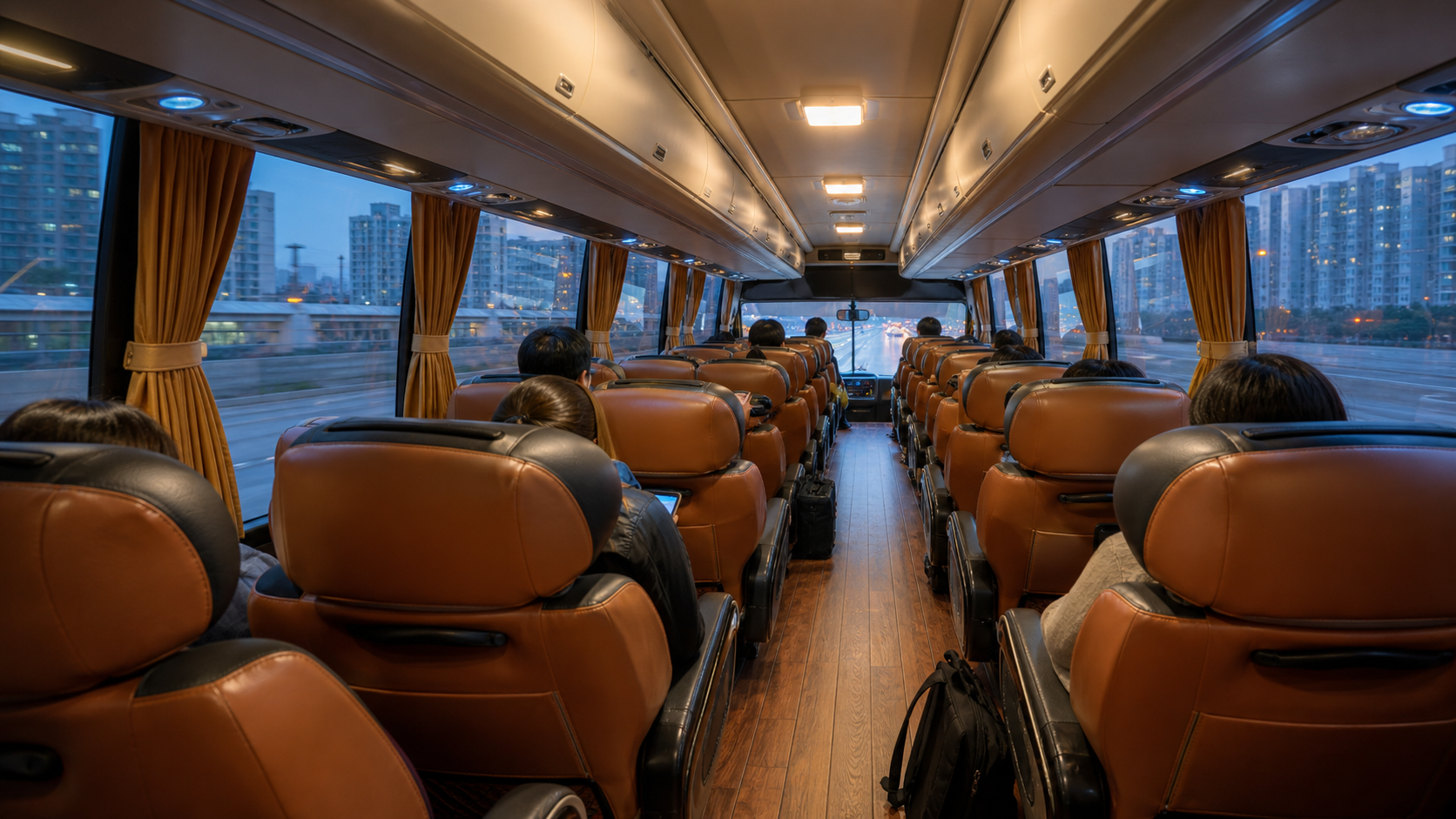 Wide leather reclining seats inside the Incheon Airport limousine bus, with curtained windows looking out on the city