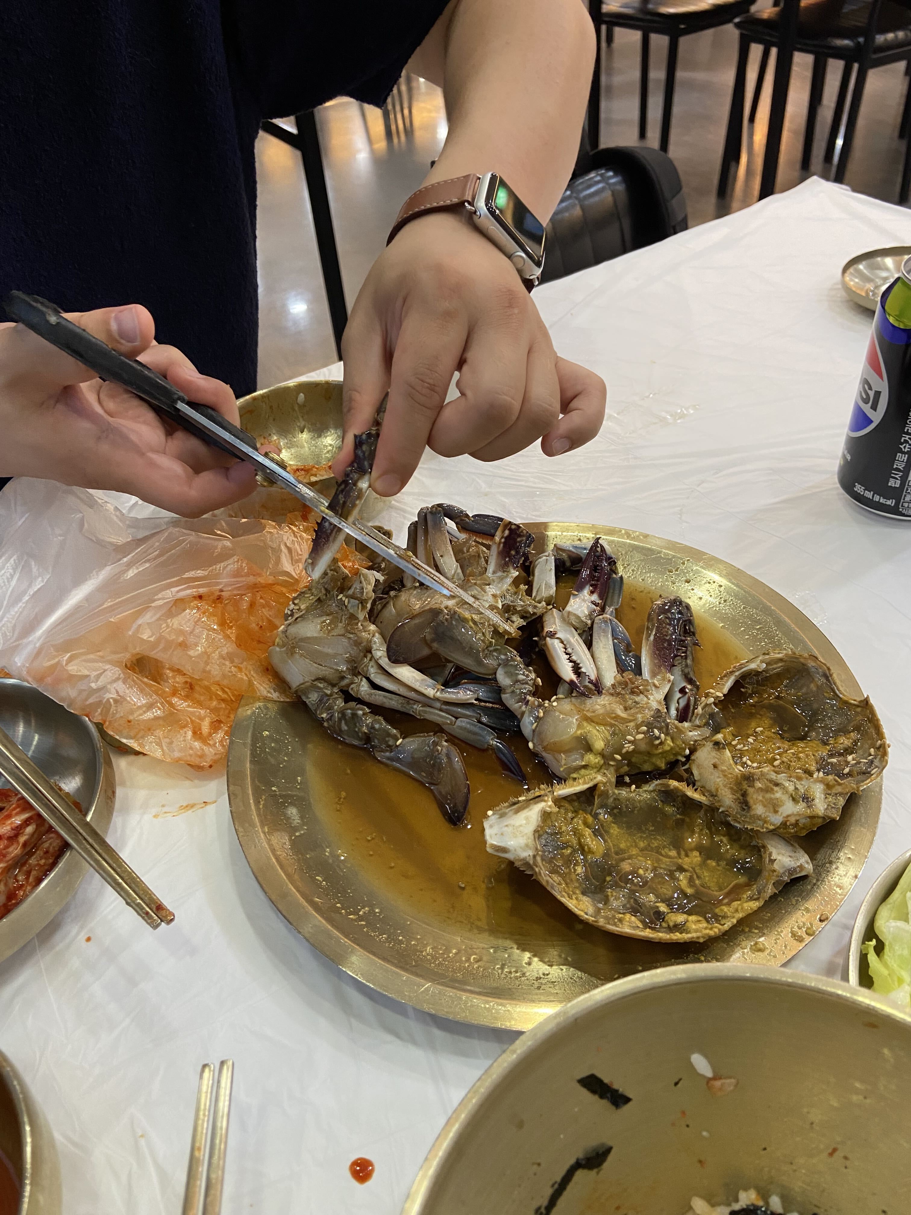 Soy sauce marinated crab being served at a Korean restaurant
