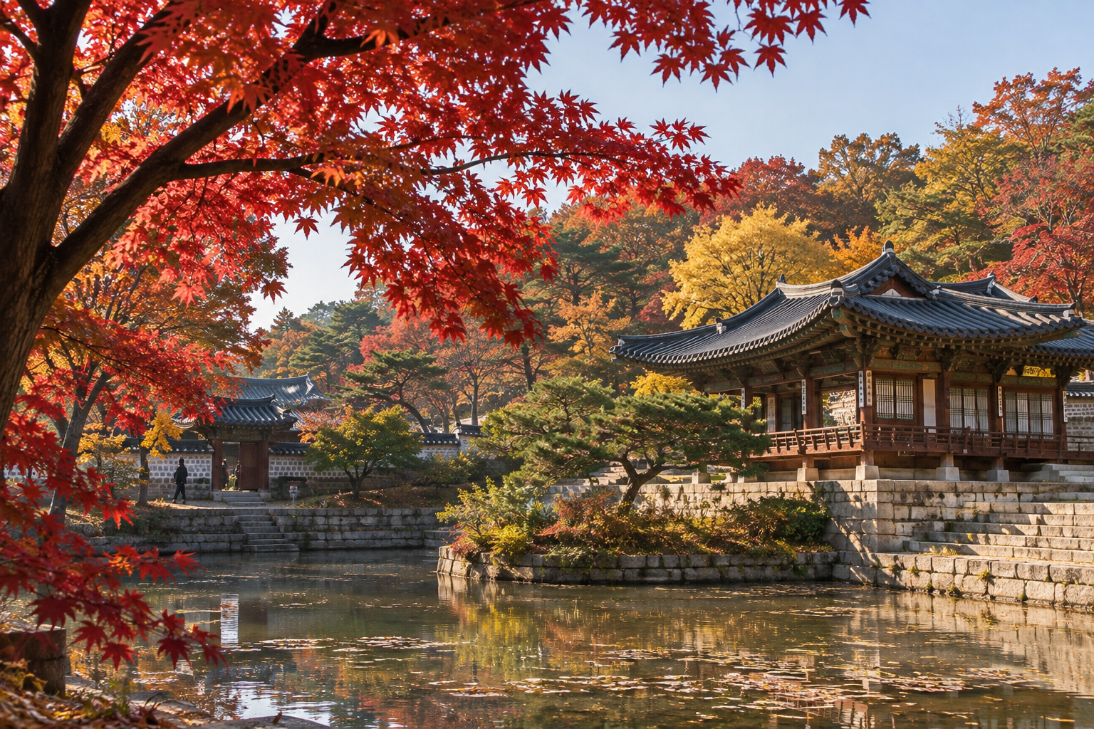 A traditional hanok pavilion at Changdeokgung palace in Seoul surrounded by red and orange autumn trees